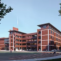 Red Brick Multi Story School Building with Sports Ground and Surrounding Green Trees