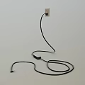 Black Cable Plugged Into Power Outlet On White Background With Coiled Wire On Floor