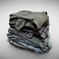 Stack of Casual Clothing Featuring Denim Jeans and Cotton T Shirts in Neutral Tones