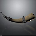 Brown Horn Household Item With Silver Metal Decorative Rings And Reflective Surface