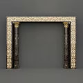 Ornate Mantel With Intricate Patterned Frame And Carved Gold Accent Columns