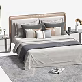 Double Bed Featuring Brown Headboard Multiple Gray Beige Pillows Bedside Tables Lamp Vase and Rug 3d model