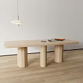 Light Wood Dining Table with Three Cylindrical Legs in Bright Room with Pendant Light