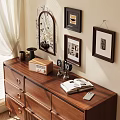 Ornamental Decoration Collection with Decorative Mirror Photo Frames Open Book and Lamp on Wooden Dresser