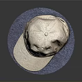 Beige Boston Cap With Blue Lettering Placed On Soft Blue Mat