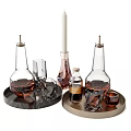 Wine Bottles And Glasses With Brown Liquid On Marble And Metal Trays