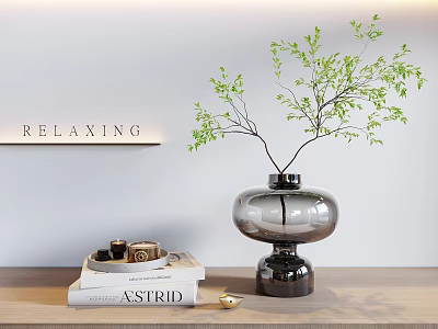 Relaxing Decorative Ornament Set Featuring Glass Vase Green Foliage Books and Wooden Tabletop 3d model