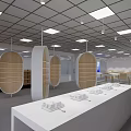 Modern Exhibition Hall With White Display Tables Wooden Legs Large Screen And Bright Lighting