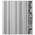 Modern Interior Door With Black Panel Gold Handles And Bookshelf Green Plant