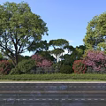 Lush Roadside Garden with Green Shrubs Pink Red Flowers and Blue Sky