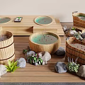 Wooden Bathtubs With Water And Rose Petals Surrounded By Stones And Green Plants
