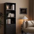 Modern Black Bookcase With Stacked Books Framed Art Table Lamp Near Sofa And Plant