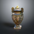 Carved Sculpture Vase With Winged Decorations Golden Lid And Relief Figures