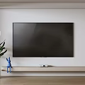 Large Screen Wall Mounted Television On Wooden Stand With Blue Rabbit Figurine And Green Plant