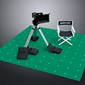 Professional Electronic Camera With Tripod And Director Chair On Green Mat