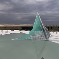 Modern Green Conical Tower With Glass Grid Structure And Water Reflection 3d model