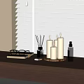 Elegant Decorative Accessories Set With Candles Aromatherapy Bottle Eyeglasses On Wooden Table By Window Blinds