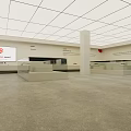 Spacious Exhibition Hall With Glass Display Cases And Red Logo Screen