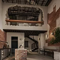 Industrial Restaurant Interior With Exposed Ceiling Brick Walls Wooden Beam And Metal Staircase