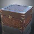 Ornate Wooden Storage Box With Intricate Carvings And Metal Corner Accents