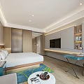 Hotel Guest Room with Large Bed Open Kitchen Marble Countertop Living Area and Modern Design