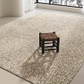 Neutral Toned Square Rug With Textured Pattern In Bright Room With Wooden Stool And Natural Light