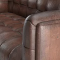 Brown Leather Tufted Sofa With Vintage Design And Black Tapered Legs