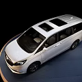 White MPV Car With Sleek Exterior Design And Modern Alloy Wheels