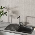 Black Kitchen Sink with Modern Faucet and Sleek Countertop in Kitchen Setting