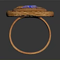Classic Elegant Golden Carved Ring Featuring Blue Gemstone And Intricate Design