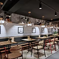 Modern Industrial Café Interior With Wooden Tables Hanging Lights And Brick Walls