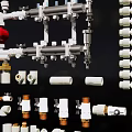 Assorted White And Brass Plumbing Fittings With Manifold Valves And Connectors Components