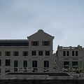 European Style Commercial Street With Outdoor Seating And Classic Architecture And Shop Fronts