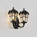 Classic Black Wall Lamps With Decorative Glass Shades Illuminated On Stone Wall