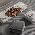 Modern Home Setup With Gray Cushions Brown Blanket And Striped Rug