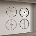 Four Modern Clocks Hung on Light Wall With Unique Designs Near Vertical Striped Decor