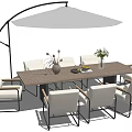 Outdoor Wooden Table with White Metal Chairs and Umbrella for Patio Dining Area