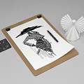 Clipboard With Sketch Drawing Pen Origami Decoration And Small Black Object On White Background
