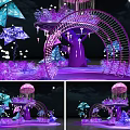 Enchanting Purple Arch Decorations With Illuminated Blue Floral Elements And Lights