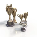 Ornate Metal Award Trophies Collection With Various Designs And Decorative Bases