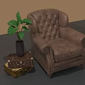 Brown Leather Tufted Armchair With Suitcase Side Table And Green Plant
