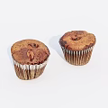 Freshly Baked Muffins With Brown Surface And Speckled Texture In Paper Liners On White Background