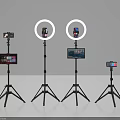 Live Streaming Equipment Setup With Tripods Smartphones Ring Lights And Screens