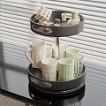 Black Two Tier Tray With Ceramic Mugs Glass Cups And Small Decorative Items