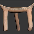 Handcrafted Wooden Stool With Intricate Geometric Patterns And Unique Leg Design