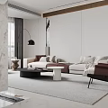 Modern Living and Dining Room Interior With Beige Sofa White Armchair And Black Coffee Table