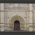 Ancient Entrance Gate Featuring Arched Door Decorative Columns And Colorful Stone Walls
