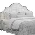 Modern Beige Double Bed With Curved Headboard Plush Pillows And Nightstand