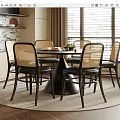 Modern Round Black Dining Table With Woven Backrest Chairs In Kitchen Area With Window Rug