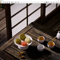 Classic Tea Set Featuring Pouring Teapot Colorful Pastries And Teacups On Wooden Table